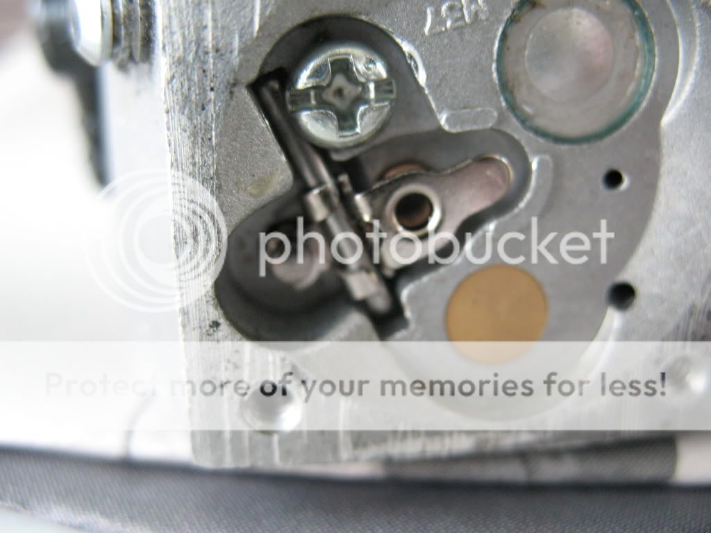 026 spitting gas out of carb